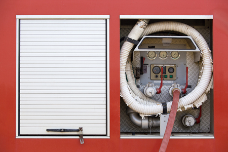 high pressure water pump valve with fire hose on fire truckの写真素材