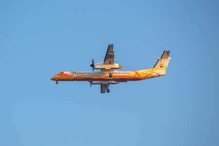 BANGKOK, THAILAND - December 20, 2017: Bombardier Dash 8 Q400  HS-DQG of Nok Air landing to runway 03L Don Mueang International Airport Thailand.のeditorial素材
