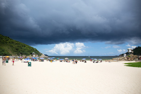 Hong Kong, China - july 14, 2017. Rain cloud and storm over Big wave bay beach eastern coast of Hong Kong Island.Big Wave Bay or Tai Long Wan is located on south of Cape Collinson and north of Shek O.のeditorial素材