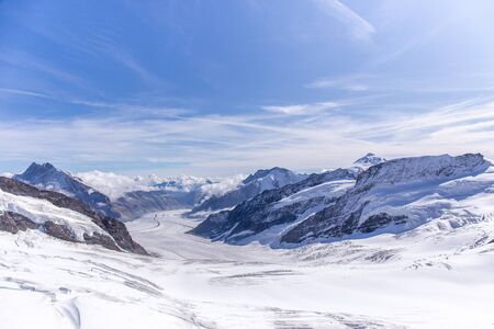 Great Aletsch glacier of Swiss and Bernese Alps and jungfrau snow mountain peak view from...