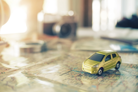 Travel concept background vintage effect,car on the map.の写真素材