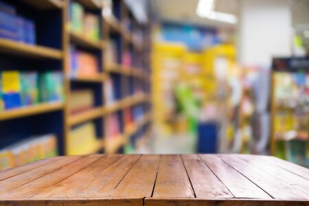 Empty wooden table and modern library background.の写真素材