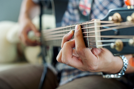 A man play electric guitar vintage effect tone.の写真素材