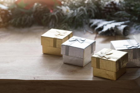 Gift box decoration on wood table with vintage tone.の写真素材