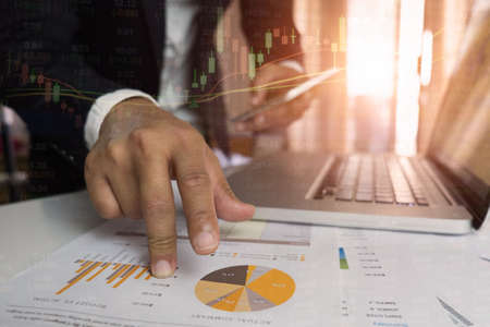 Double exposure of success businessman working in office with digital tablet laptop computer and...