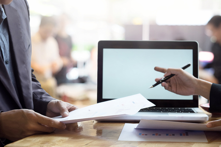 Close up business talking on desk with business presentation concept with vintage tone.の写真素材