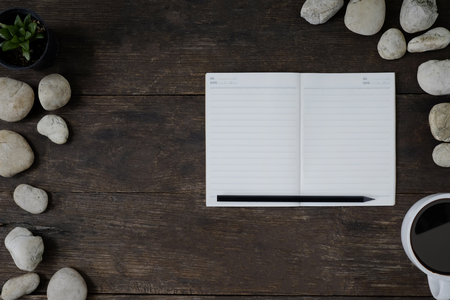 notepad on wood desk.の写真素材