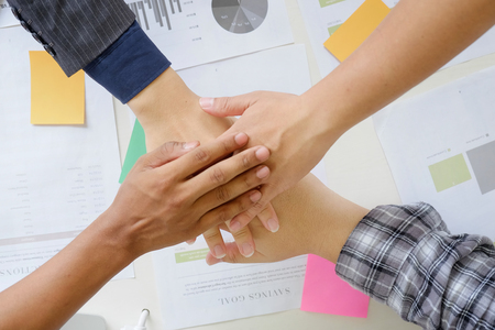business cooperate hands join on office desk with close up.
