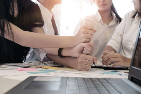 Collaboration business team hold your hand on office table, vintage toneの写真素材