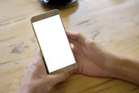 Woman hand holding smartphone with empty screen for a presentation.