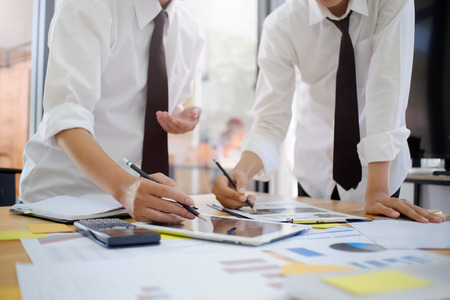 Business planing with tablet and data chart paper on table in the business office.の写真素材
