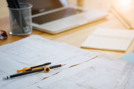 dividers on blue print architecture desk with a light morning.