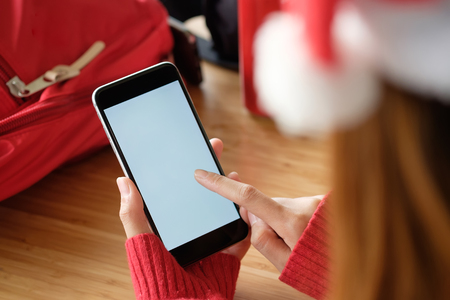 woman using smartphone with isolate white empty screen display.の写真素材