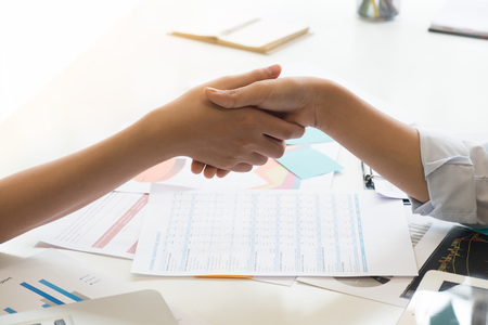 Business Partnership concept. Closeup business shaking hands finishing up a meeting,acquisition concept.の写真素材