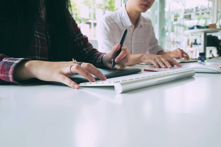 Startup business cropped hot of young business working with computer.の写真素材
