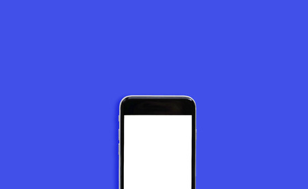 Cropped smartphone on blue background.の写真素材