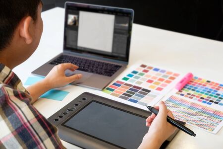 Closeup graphic designer working creative with laptop and mouse pen on artist workplace.