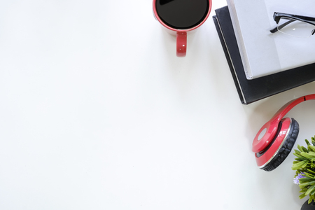 Top view table with education desk cup of coffee and book, headphone,glasses with copy space.の写真素材