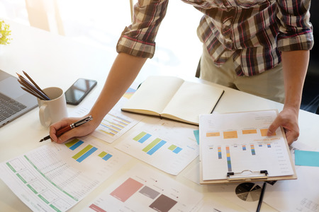 Business analysis man working with paper document business data on workplace office.の写真素材
