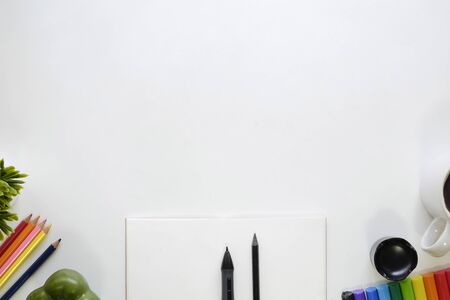 Top view Artist workspace with mockup and space on white table.の写真素材