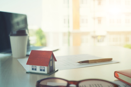 Mortgage contract for sale of contract house with paper and vintage tone.の写真素材
