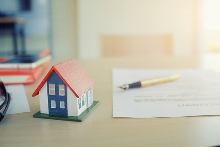 Mortgage contract for sale of contract house with paper and vintage tone.の写真素材