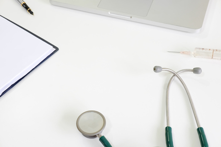 Medical equipment on work table with stethoscope.の写真素材