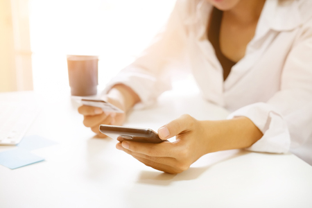 Female shopping online on smartphone.の写真素材