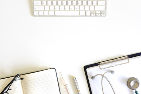 Doctor workspace with Medical equipment on white table with top view.の写真素材