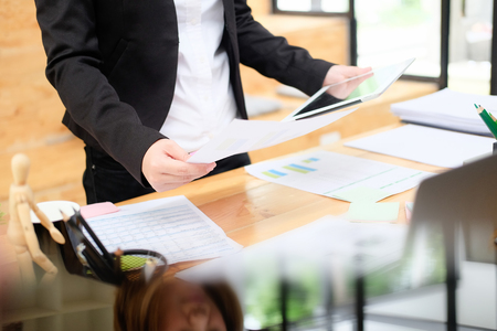 Business woman working with tablet computer analysis data of financialの写真素材