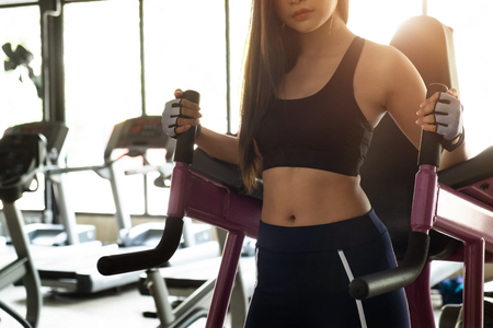 Woman body sport doing exercises.Concept of healthy lifestyle. Cross fit bodybuilder in the gym.の写真素材