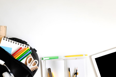 Back to school. Items for the school colourful supplies on white table ready for your designの写真素材