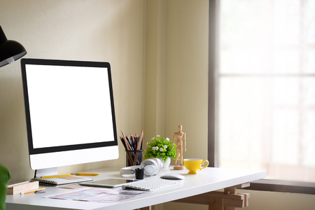 Side view mockup computer on office workplace.の写真素材