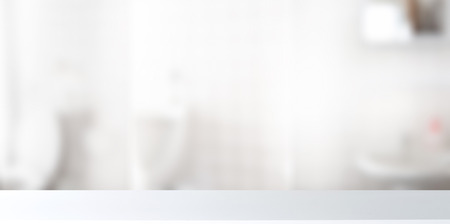 Table Top white desk And Blur Bathroom Of The Background.の写真素材