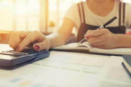 Calculation of business cropped shot of woman using calculator with calculate business finance data...