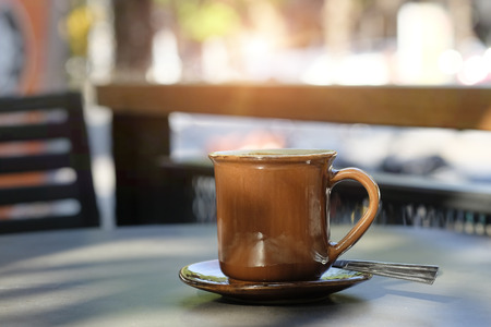 Coffee morning concept, Mug of coffee on table and morning light.の写真素材