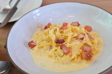 fettucine white cream sauce in white plate.の写真素材