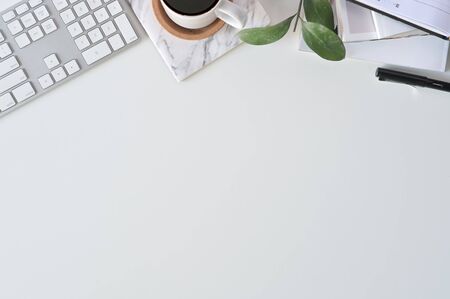 Flat lay top view office desk. Workspace with keyboard and office supplies, Copy space concept.の写真素材