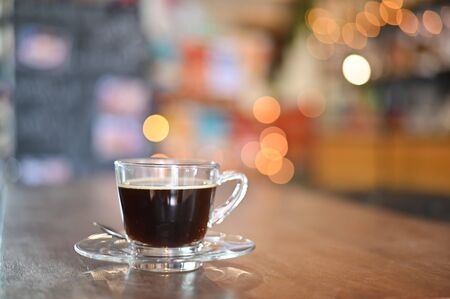 Coffee cup on wood table in cafe.の写真素材