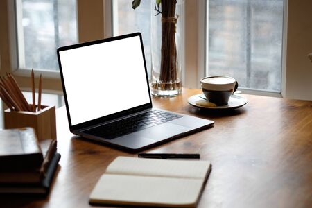 Mockup laptop computer on wooden table.の写真素材