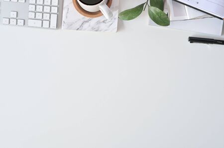 Flat lay top view office desk. Workspace with keyboard and office supplies, Copy space concept.の写真素材