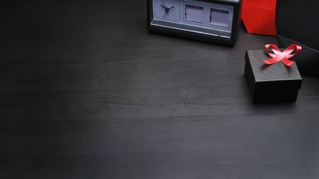 Black Friday concept, black gift box and red ribbon on black background.の写真素材