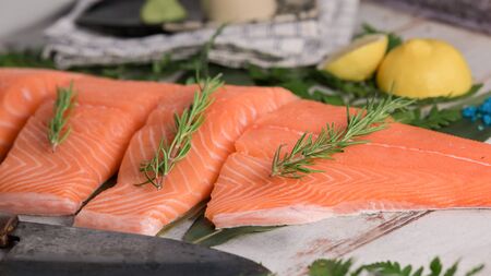 Salmon fillet with raw on wooden plate.の写真素材
