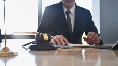 Judge gavel Justice lawyers, Businessman in suit or lawyer working on a documents. Legal law, advice and justice concept.の写真素材