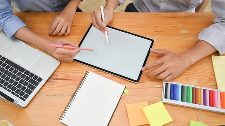 Attractive creative meeting with digital tablet on wood table.の写真素材