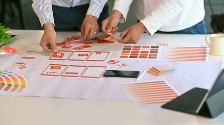 Ux Ui concept, Closeup team of development software mobile working with design workspace.の写真素材