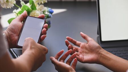 Closeup communication with smartphone concept.