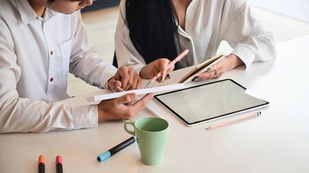 Cropped shot of Creative team are meeting/planning on work desk.の写真素材