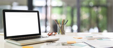 A beautiful woman is using a computer tablet and stylus pen while sitting in the meeting room.
