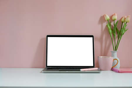 A beautiful woman is using a mobile phone while sitting in office.の写真素材